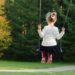 Little Girl On Swing
